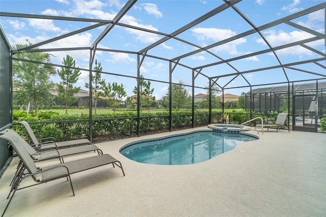 view of swimming pool featuring glass enclosure, a patio area, and an in ground hot tub