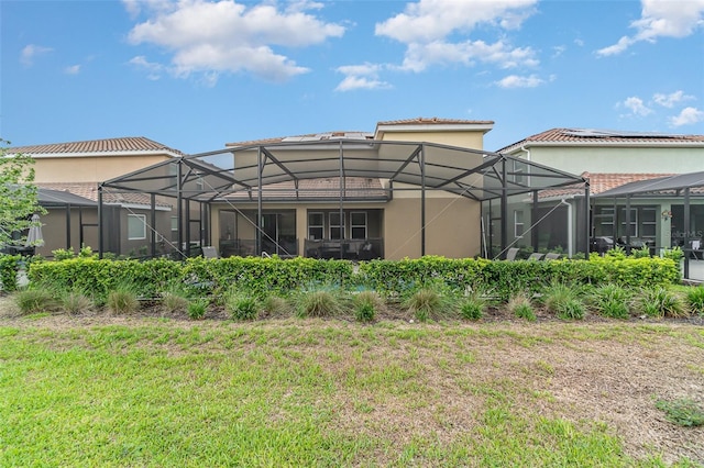 back of property with glass enclosure