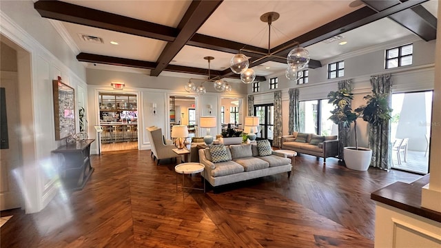 living room with beamed ceiling, coffered ceiling, dark wood-type flooring, and a notable chandelier