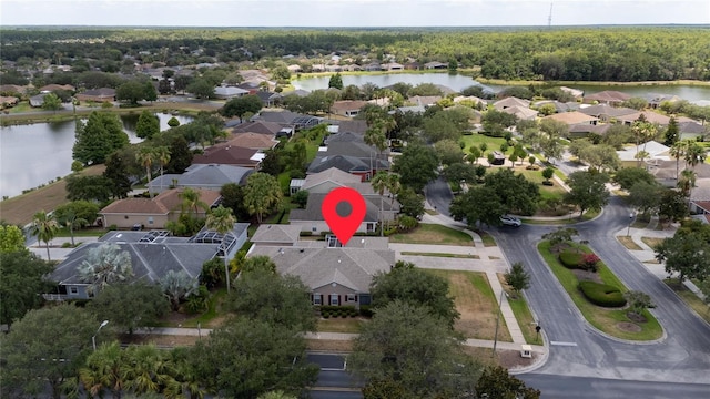 birds eye view of property with a water view