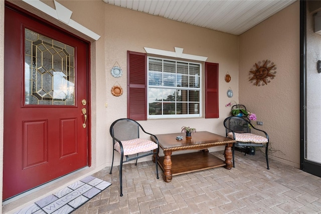 entrance to property featuring a porch