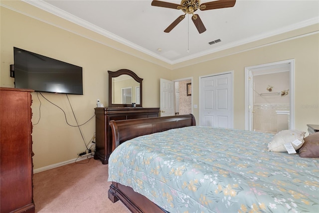 carpeted bedroom featuring connected bathroom, ceiling fan, and ornamental molding