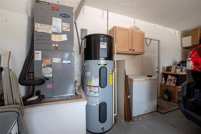 utility room featuring heating unit and heat pump water heater