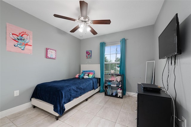 bedroom featuring ceiling fan and light tile patterned flooring