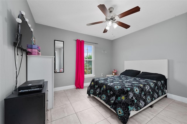 tiled bedroom with ceiling fan