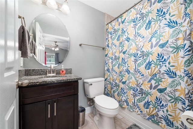 bathroom featuring toilet, ceiling fan, a shower with shower curtain, tile patterned floors, and vanity