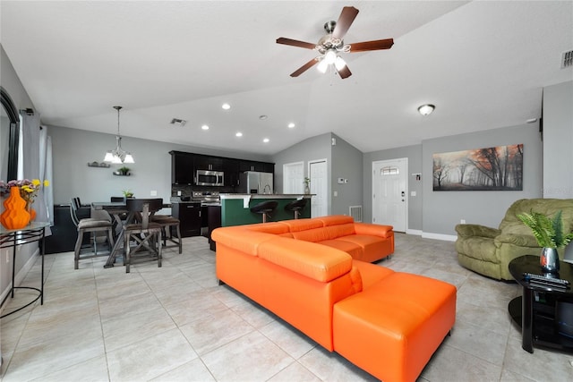 tiled living room with vaulted ceiling and ceiling fan with notable chandelier