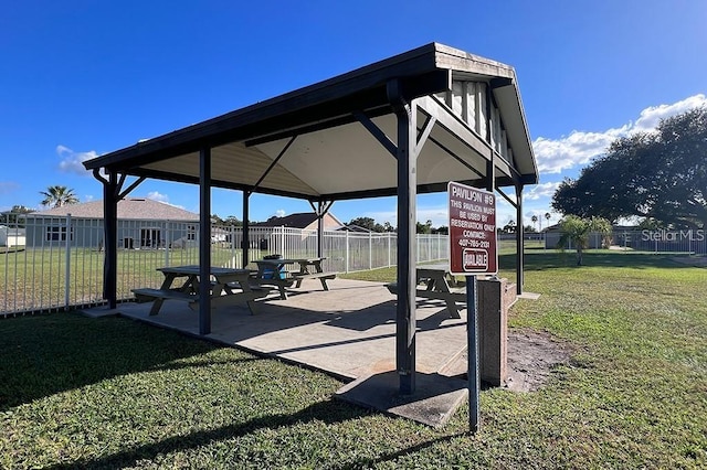 view of property's community with a lawn and a gazebo