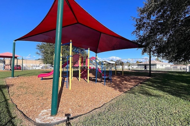 view of play area featuring a lawn