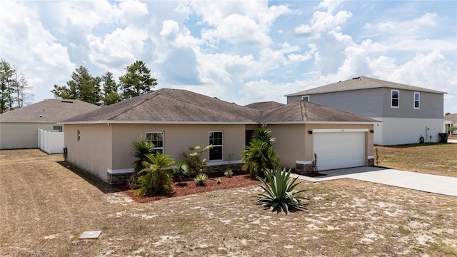 single story home featuring a garage