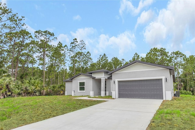 view of front facade featuring a garage, concrete driveway, a front yard, and central air condition unit