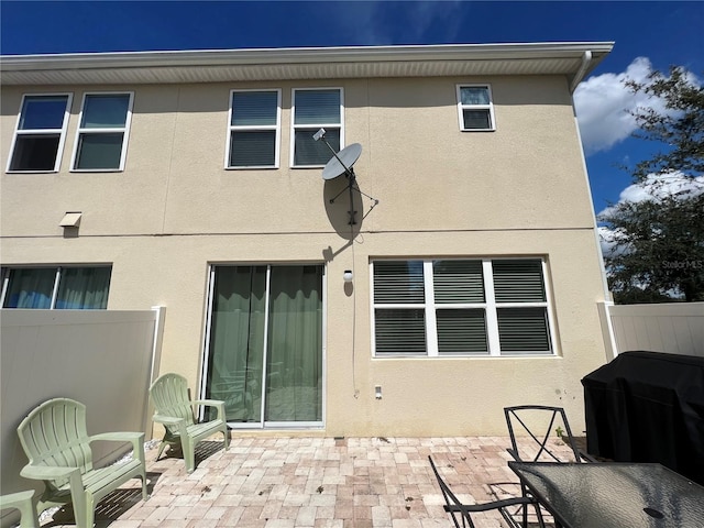 back of house featuring a patio area