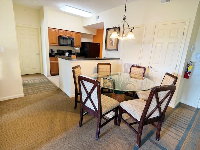 carpeted dining area with an inviting chandelier