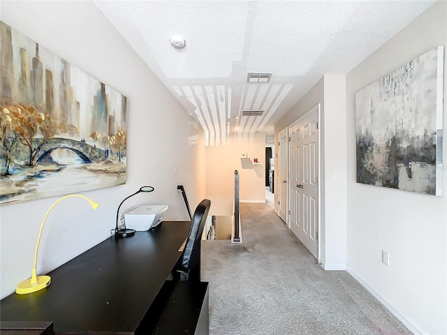 hallway with carpet floors