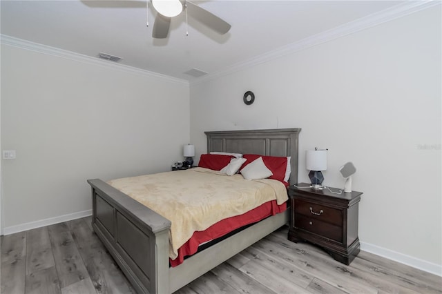 bedroom with crown molding, ceiling fan, and hardwood / wood-style floors