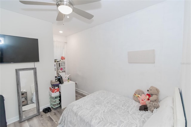 bedroom with light wood-type flooring and ceiling fan