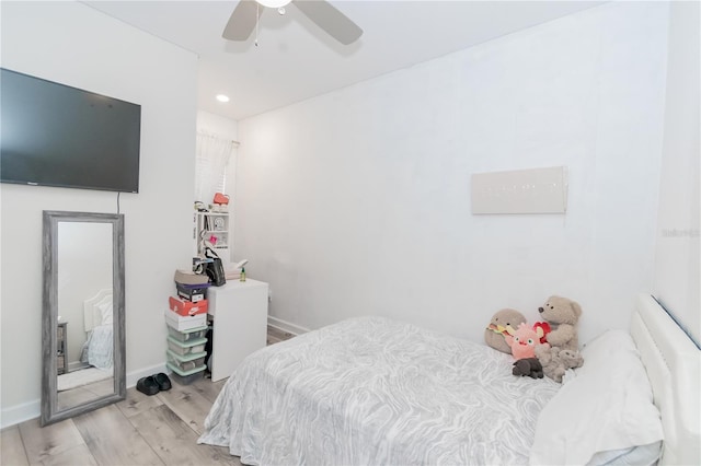 bedroom with ceiling fan and light hardwood / wood-style flooring