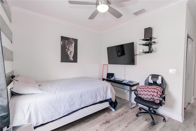 bedroom featuring wood-type flooring, ceiling fan, and crown molding