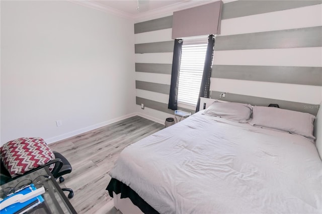 bedroom featuring light hardwood / wood-style floors and crown molding