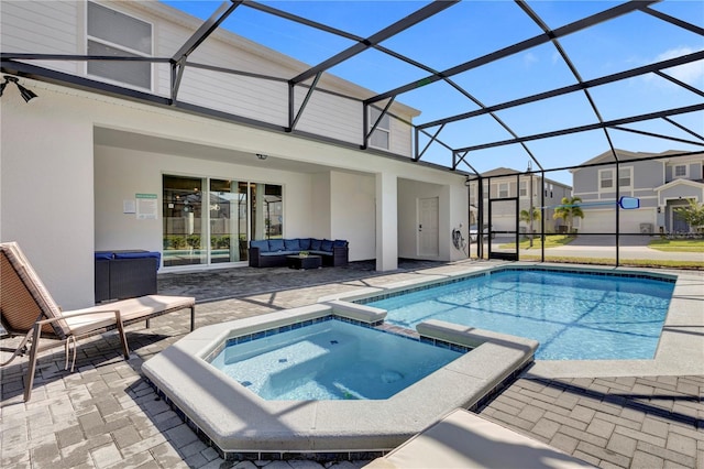 view of swimming pool with an in ground hot tub, a lanai, an outdoor living space, and a patio area