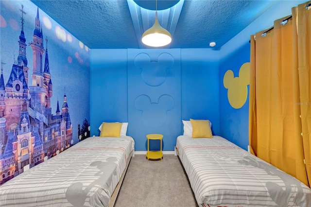 bedroom featuring a textured ceiling and carpet flooring