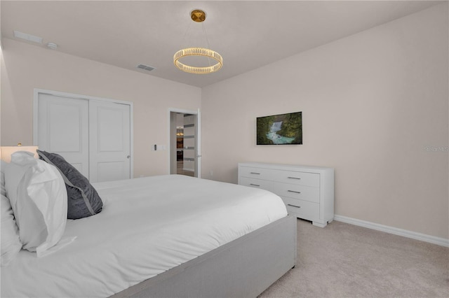 carpeted bedroom featuring a closet