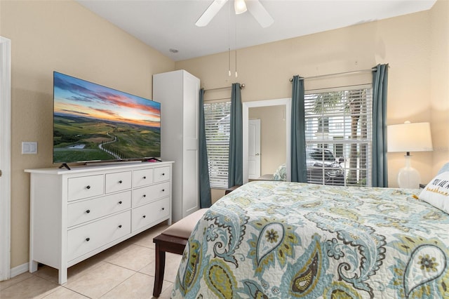 tiled bedroom with ceiling fan