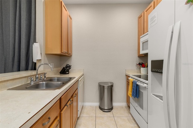 kitchen featuring sink, light tile patterned floors, and white appliances