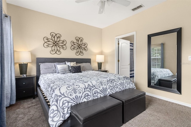 bedroom featuring ceiling fan and dark colored carpet