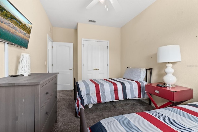 carpeted bedroom featuring a closet and ceiling fan