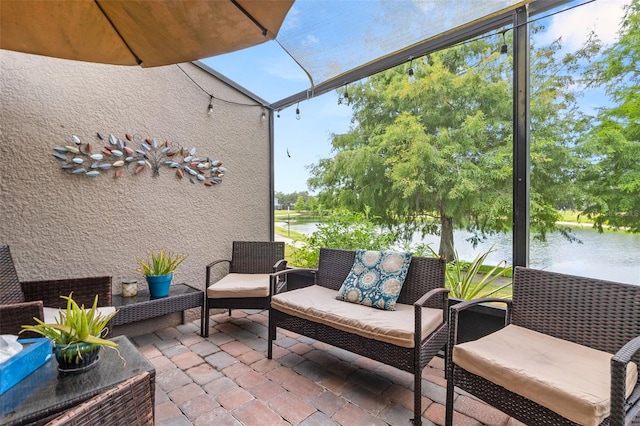 view of patio / terrace featuring an outdoor living space and a water view