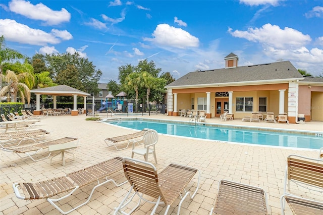 view of pool with a gazebo, a patio area, and ceiling fan