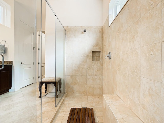 bathroom featuring a tile shower