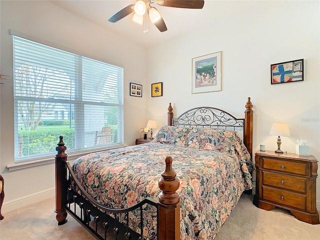 bedroom featuring ceiling fan and light colored carpet