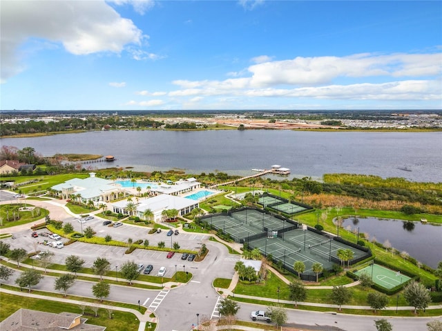 birds eye view of property with a water view