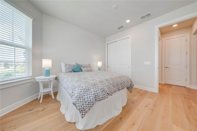 bedroom featuring a closet and light hardwood / wood-style floors