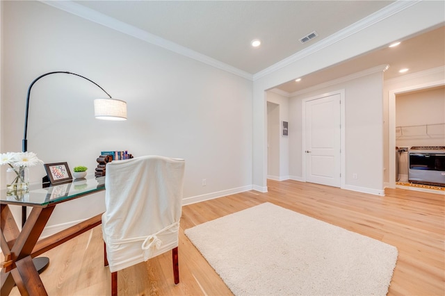 home office with hardwood / wood-style flooring, heating unit, and crown molding