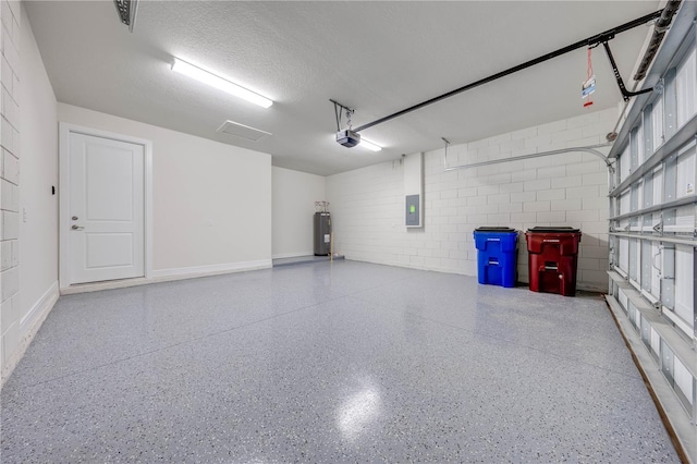 garage with a garage door opener, electric water heater, and electric panel