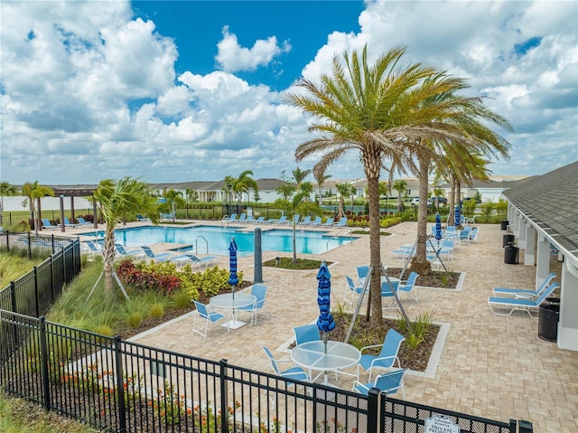 view of swimming pool with a patio area