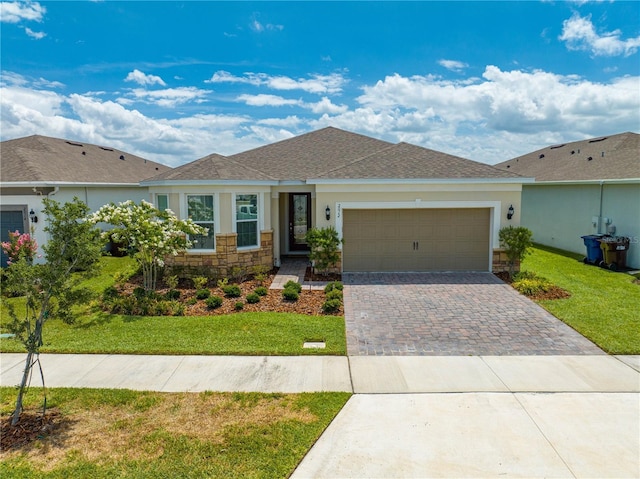 ranch-style home with a front yard and a garage