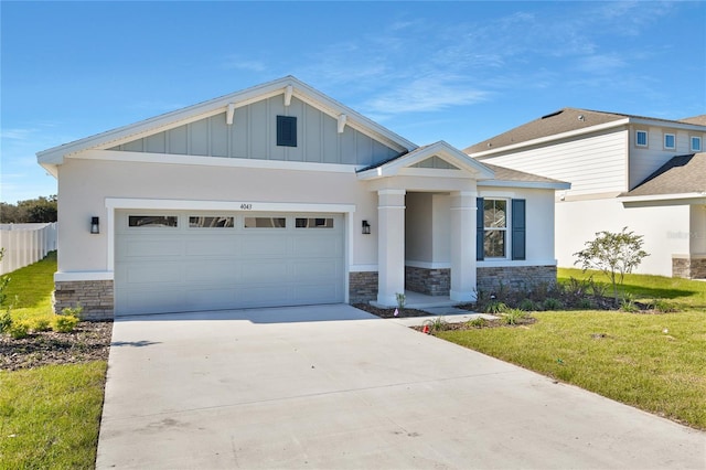 craftsman-style house with a garage and a front lawn