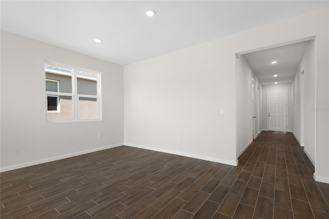 empty room featuring dark wood-type flooring