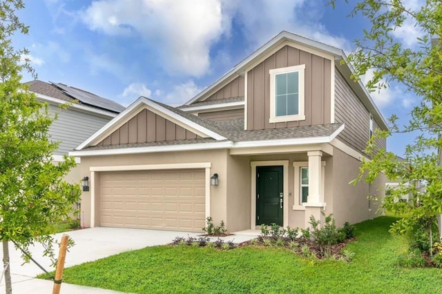 craftsman-style house featuring a garage, solar panels, and a front lawn