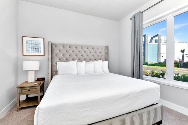 bedroom with light colored carpet