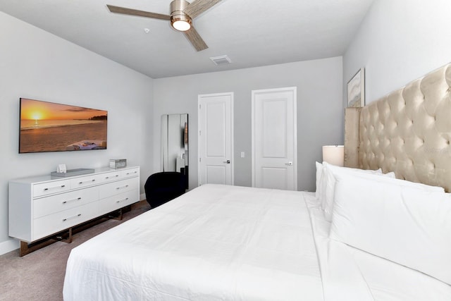 carpeted bedroom with ceiling fan