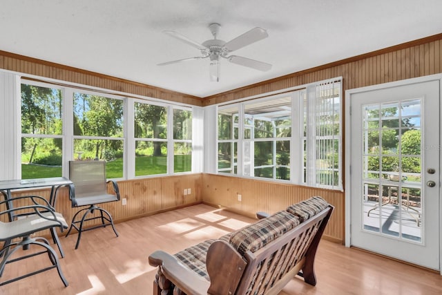 sunroom / solarium featuring ceiling fan