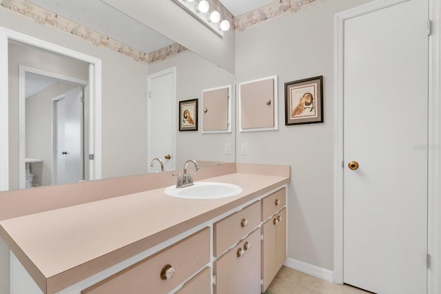 bathroom featuring tile patterned flooring and vanity