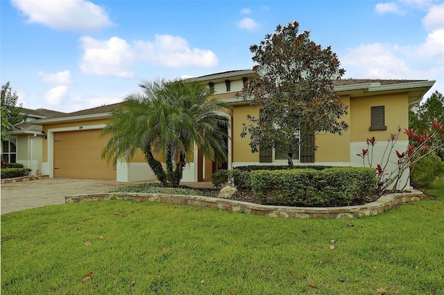 view of front of house featuring a front yard and a garage