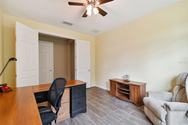 office area with ceiling fan and wood-type flooring