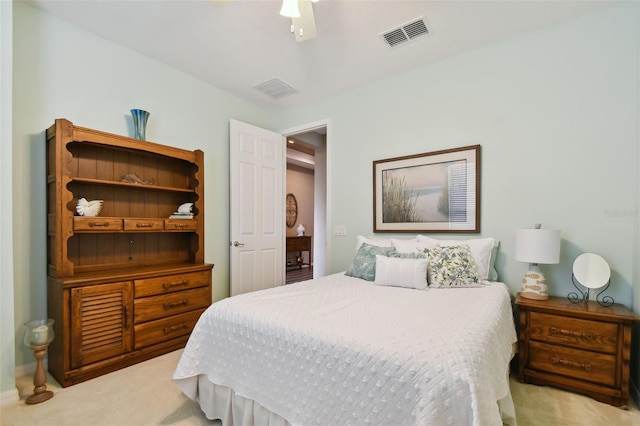 bedroom featuring light carpet and ceiling fan